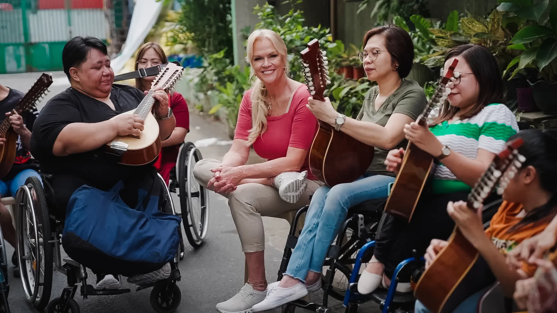 Kym gets a front row seat as Adeline and her fellow musicians play traditional Filipino songs.