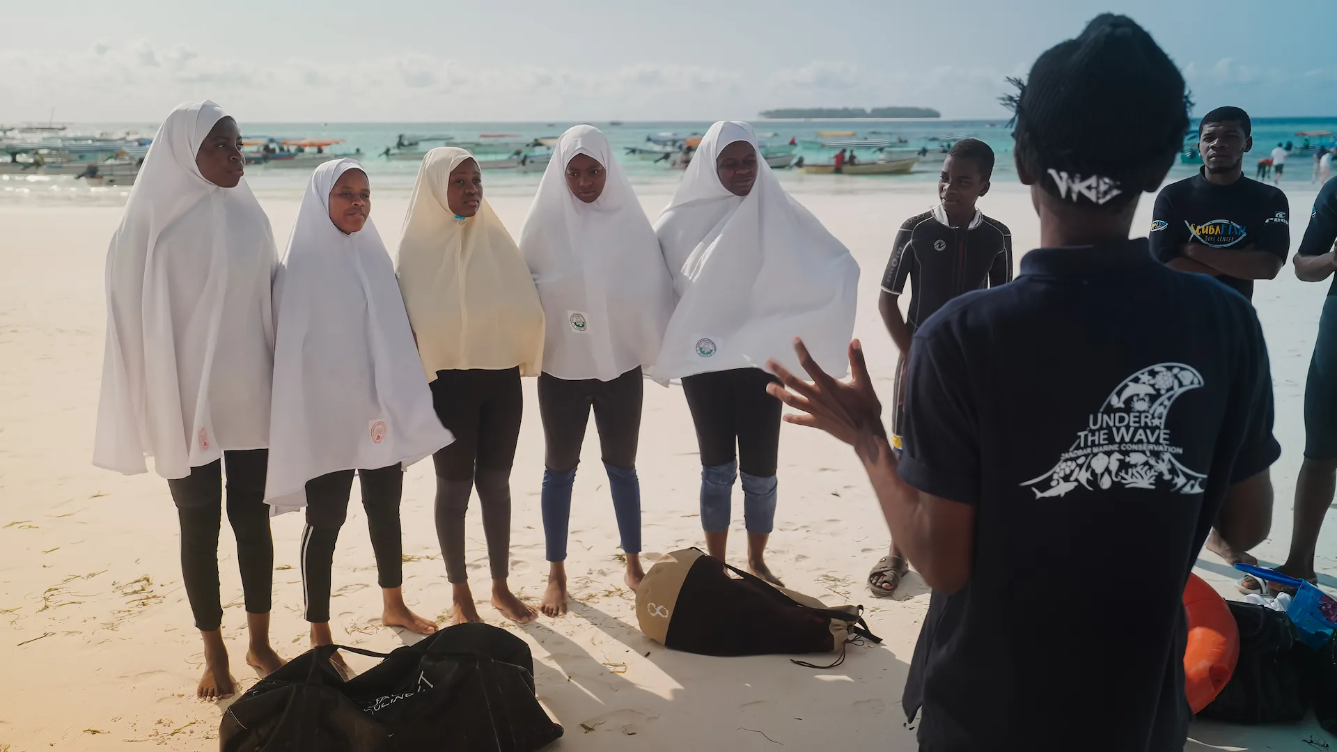 under-the-wave-students-on-beach
