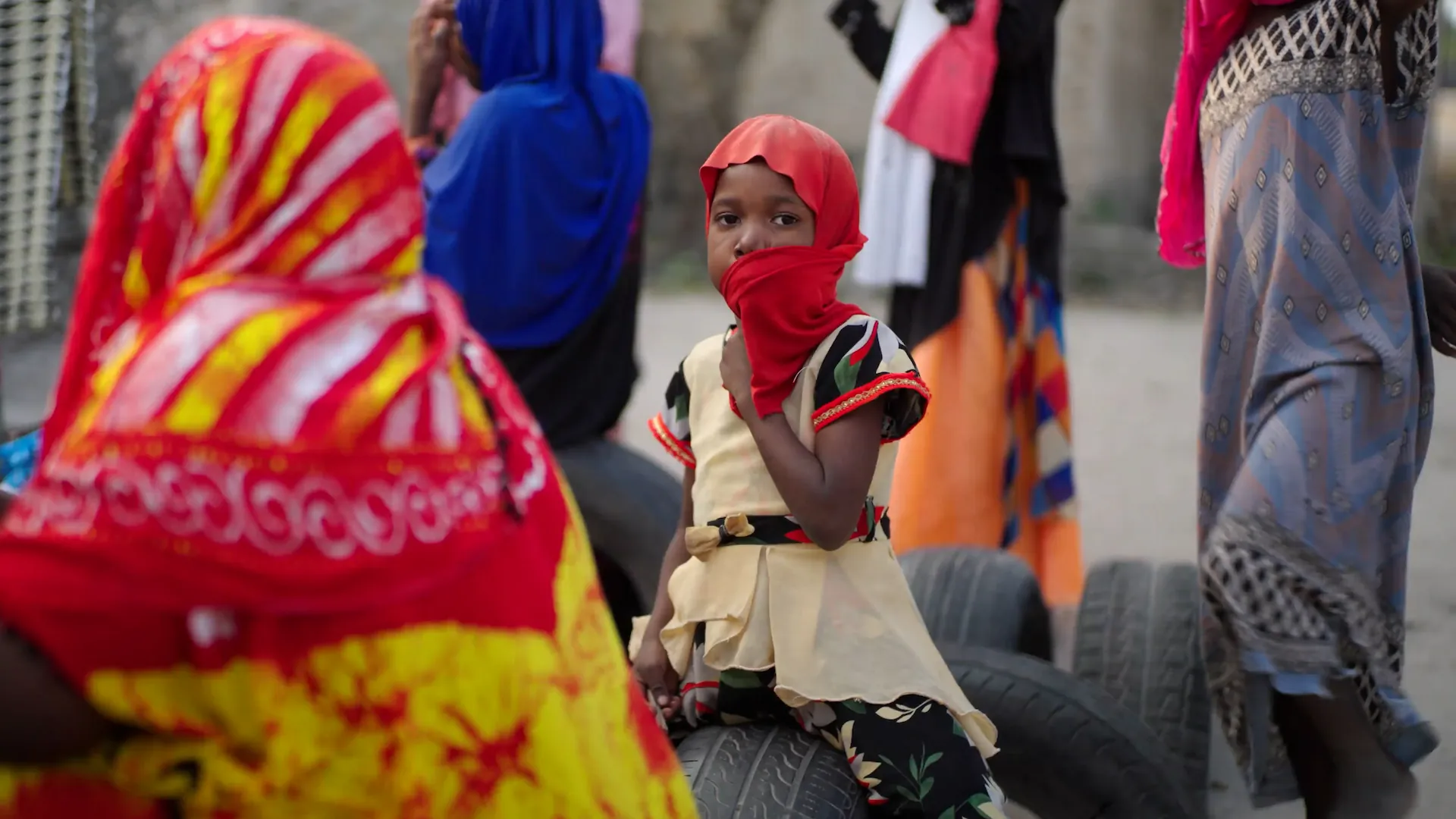 weza-young-girl-sitting-out