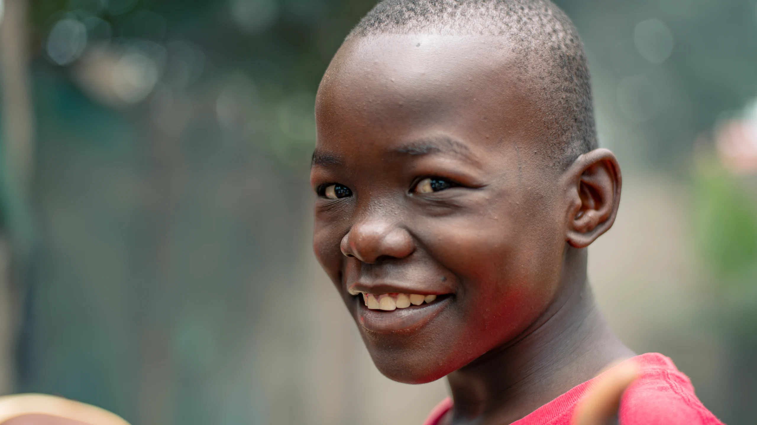 kym-rapier-foundation-ntseko-gallery-boy-red-shirt-smiling-01