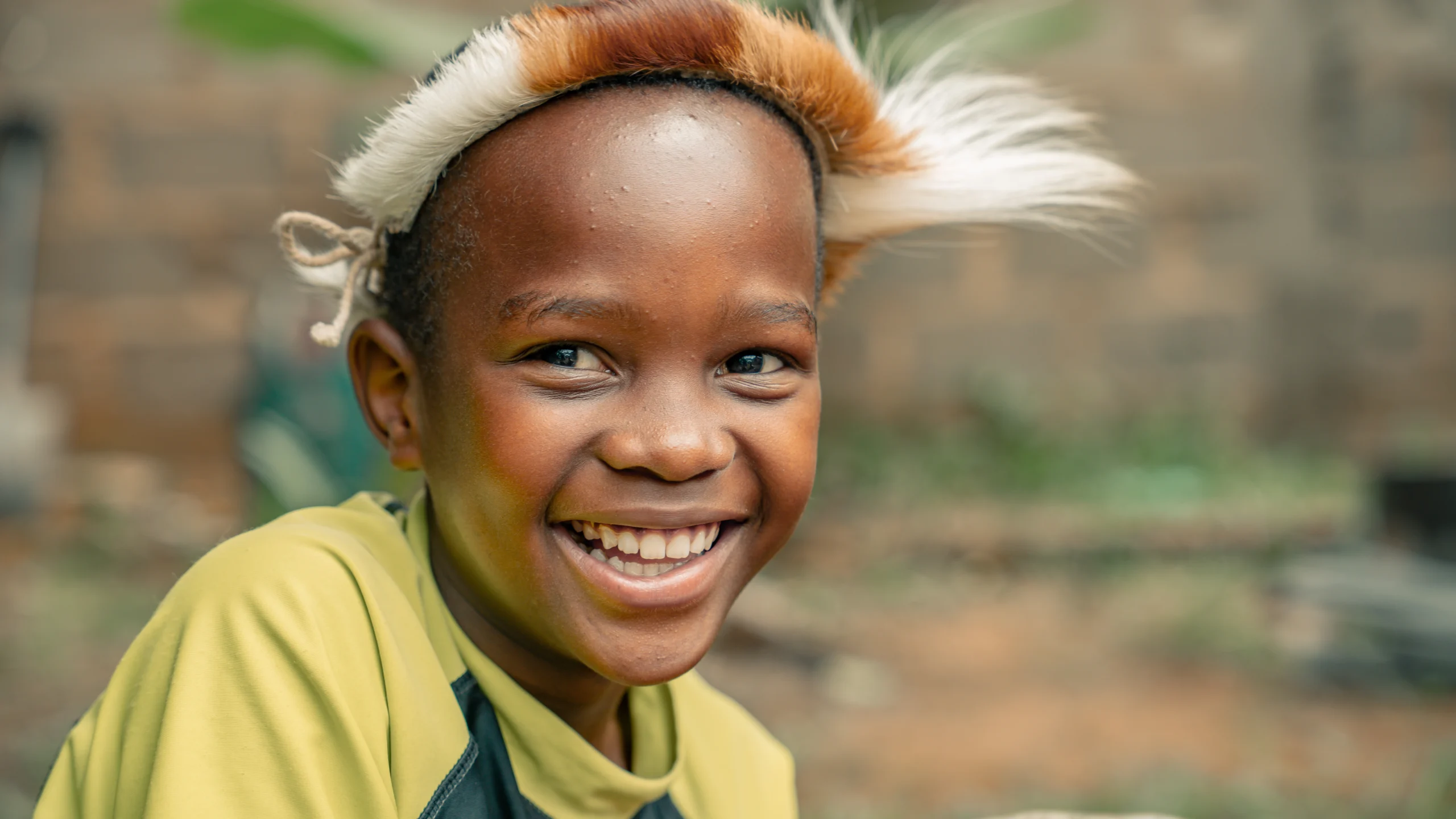 kym-rapier-foundation-ntseko-gallery-boy-yellow-shirt-smiling-01